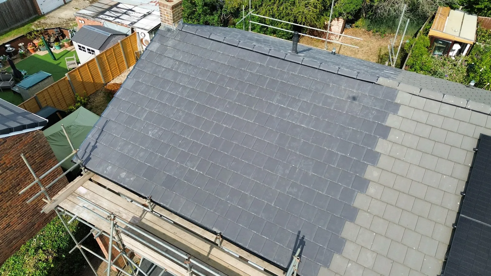 Aerial drone view of a slate re-roof in progress