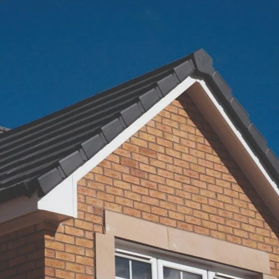 Dry verge units being installed along a gable edge