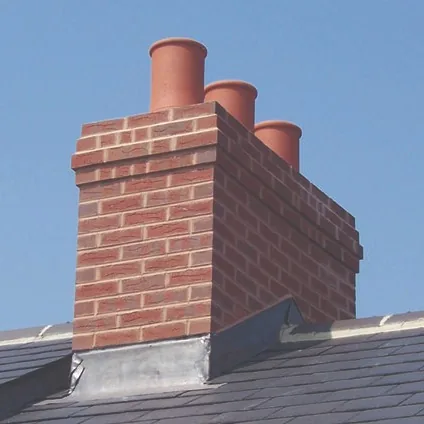 Flashing repair around a chimney to stop a leak
