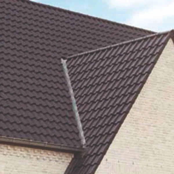 Roof being cleared of moss to protect the tiles