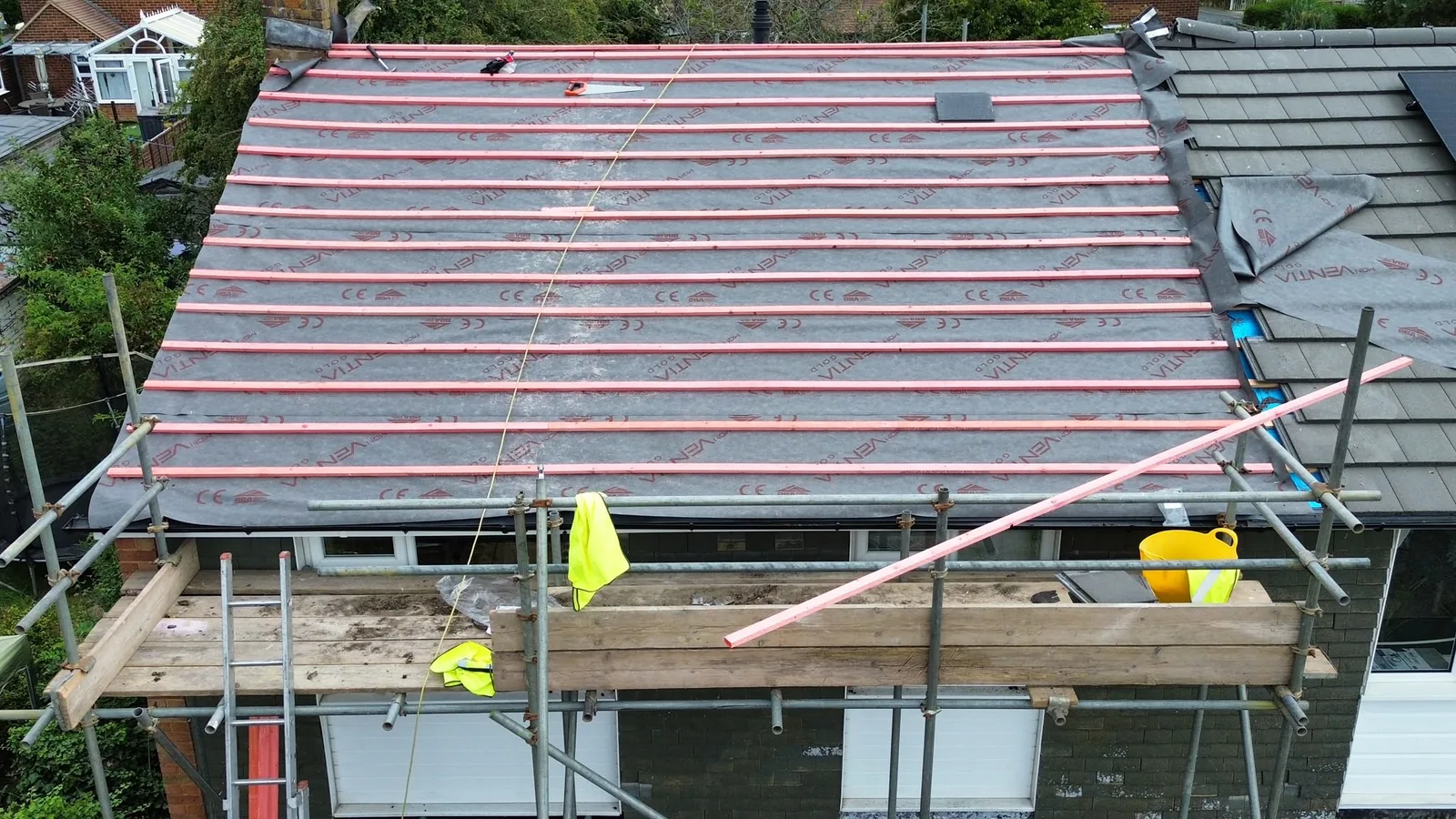 Drone view of new membrane and battens laid across a roof